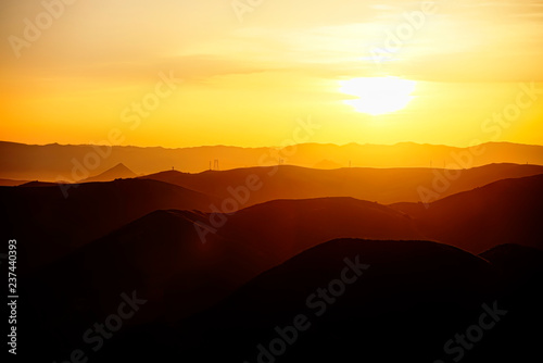 Layers of Mountains at Sunrise