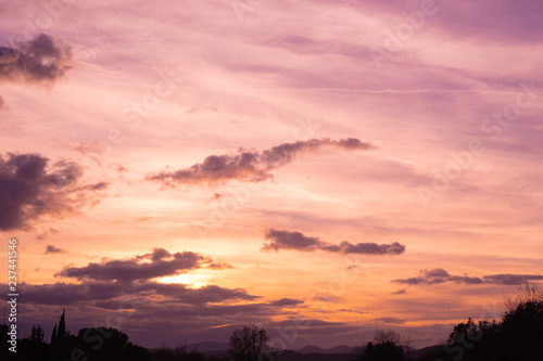 sunset in the sky over the landscape