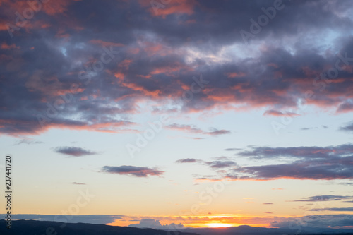 sunset over the landscape and trees