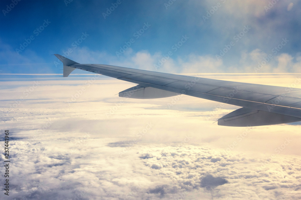 View above the clouds from the airplane window