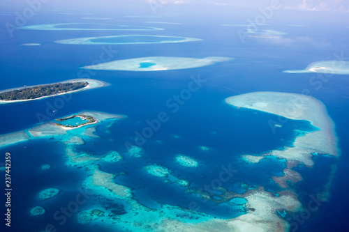 Aerial of the beautiful Maldives, looking down at some stunning islands and atolls