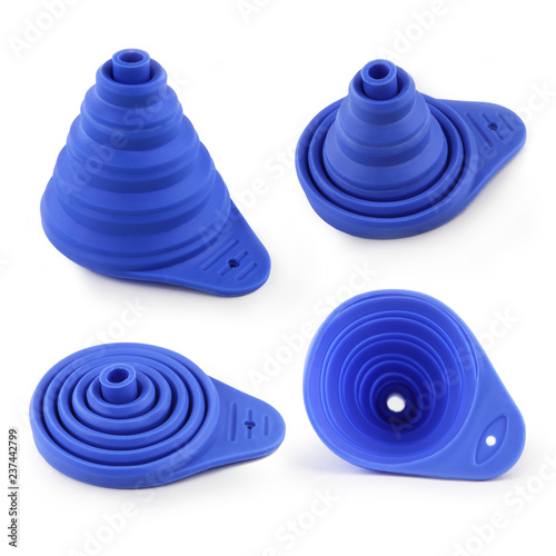 Silicone collapsible mini filling liquid water oil funnel kitchen tool in blue color. Close up macro photography on the white background. Four different positions of product.