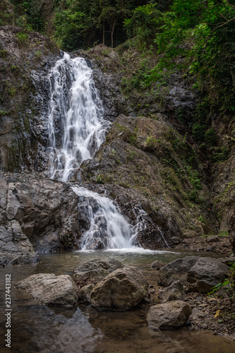 Fototapeta Naklejka Na Ścianę i Meble -  Beautiful waterfall in a green tropical forest