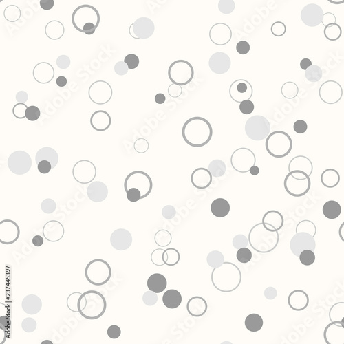 Messy gray dots and rings on white background. Colorful festive seamless pattern with round shapes. Grunge dotted texture for wrapping paper, web. Vector illustration.