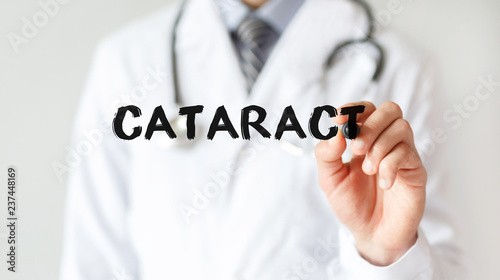 Doctor writing word CATARACT with marker, Medical concept