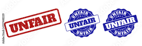 UNFAIR grunge stamp seals in red and blue colors. Vector UNFAIR labels with grunge surface. Graphic elements are rounded rectangles, rosettes, circles and text captions.