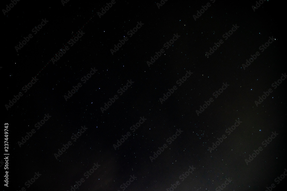 Dark starry night with track of blinking aircraft position lights Dark starry night with track of blinking aircraft position lights