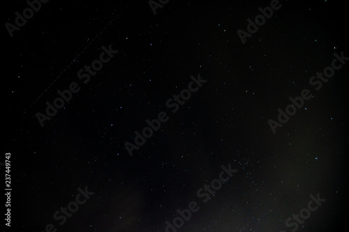 Fototapeta Naklejka Na Ścianę i Meble -  Dark starry night with track of blinking aircraft position lights