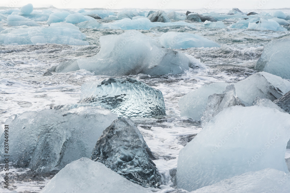 view of the ice floes in sea, by the beach in Jökulsárlón, Iceland