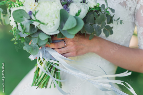Bride with wedding bouquet.