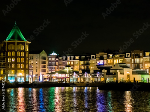 beautiful view from the water on center vleuterweide in the Meern ,Utrecht, The Netherlands. colorful cityscape with many buildings and lights photo