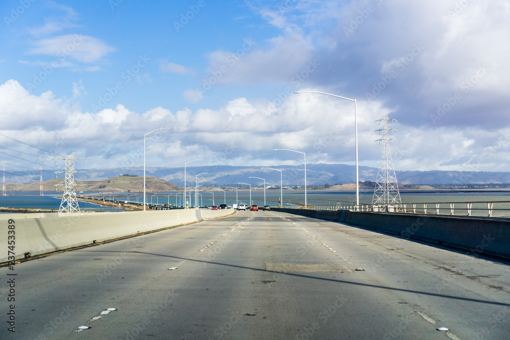 Driving on Dumbarton bridge which connects Menlo Park to Newark, San Francisco bay area, Silicon Valley, California