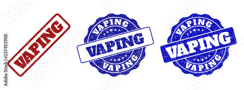 VAPING scratched stamp seals in red and blue colors. Vector VAPING imprints with grainy style. Graphic elements are rounded rectangles, rosettes, circles and text labels.