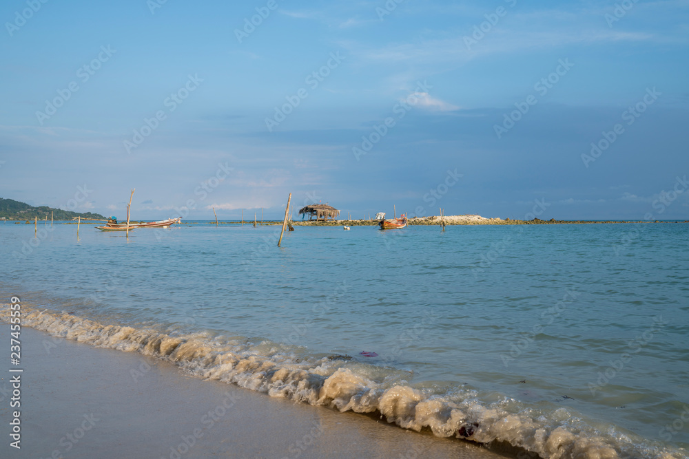 Traditional Asian long tail fishing boats moored at Bang Kao beach, Koh Samuui, Thailand. Traditional Asian long tail fishing boats moored at Bang Kao beach, Koh Samuui, Thailand.