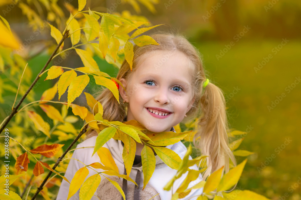 Happy little girl in the Park in autumn Happy little girl in the Park in autumn