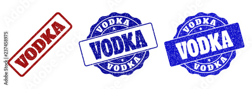 VODKA scratched stamp seals in red and blue colors. Vector VODKA signs with dirty effect. Graphic elements are rounded rectangles, rosettes, circles and text titles.
