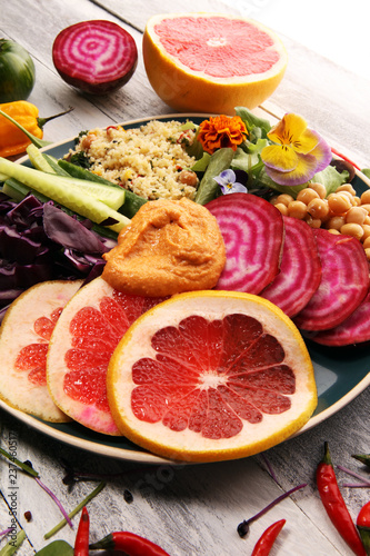 Bowl of Buddha, The concept of a healthy diet: chickpeas, salad, beetroot, pumpkin, cucumber, grapefruit, cabbage and tabouleh. Balanced food.