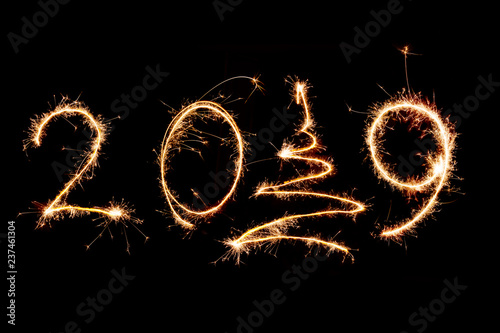 2019 written with Sparkle firework on black background, happy new year 2019 concept