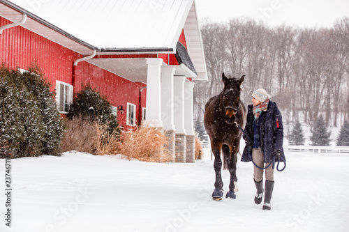 Woman Walking Horse in Winter