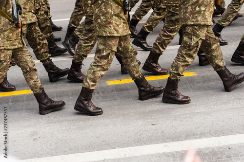 Soldiers squad seen from the waist down marching during the National Day parade in Bucharest.