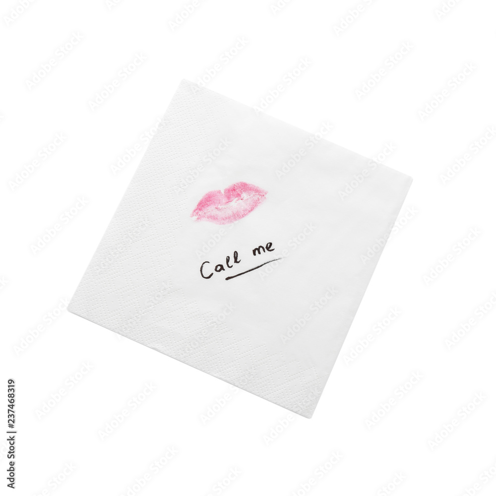 Paper napkin with lipstick mark and words CALL ME on white background, top view Paper napkin with lipstick mark and words CALL ME on white background, top view