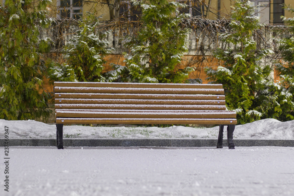 lonely bench covered with snow at night lonely bench covered with snow at night