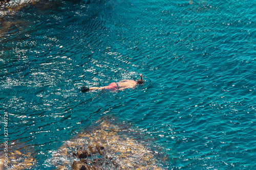 Reef de las Sirena in Cabo de Gata, Almeria, España. Cliff on the coast with turquoise blue water