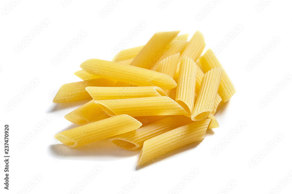 Uncooked penne rigate italian pasta, isolated on white background Uncooked penne rigate italian pasta, isolated on white background