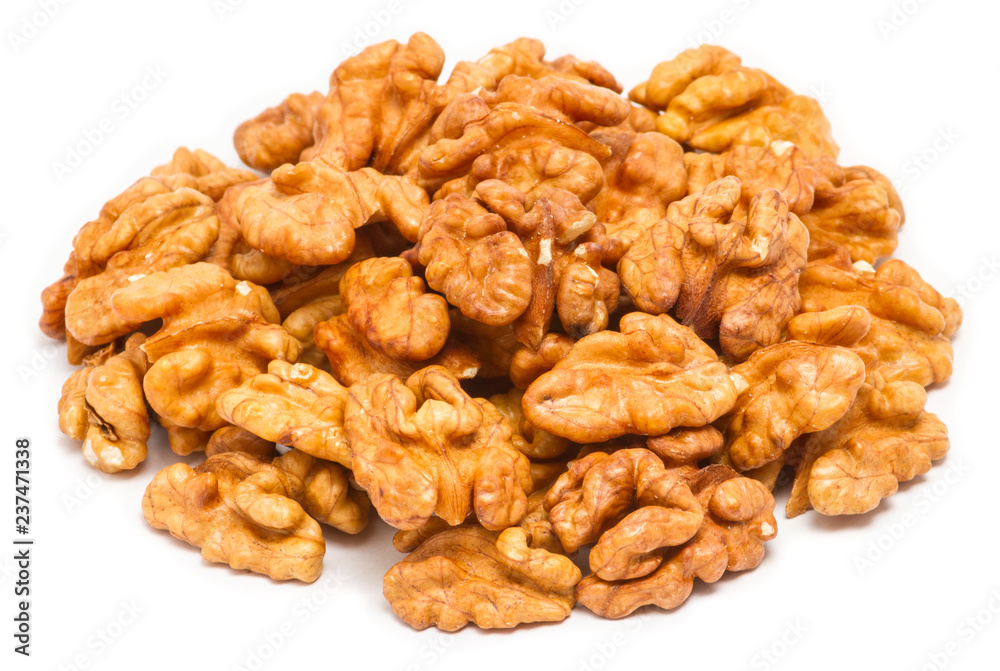 Handful of peeled walnut (Juglans regia) without shell, close up, isolated on white background Handful of peeled walnut (Juglans regia) without shell, close up, isolated on white background
