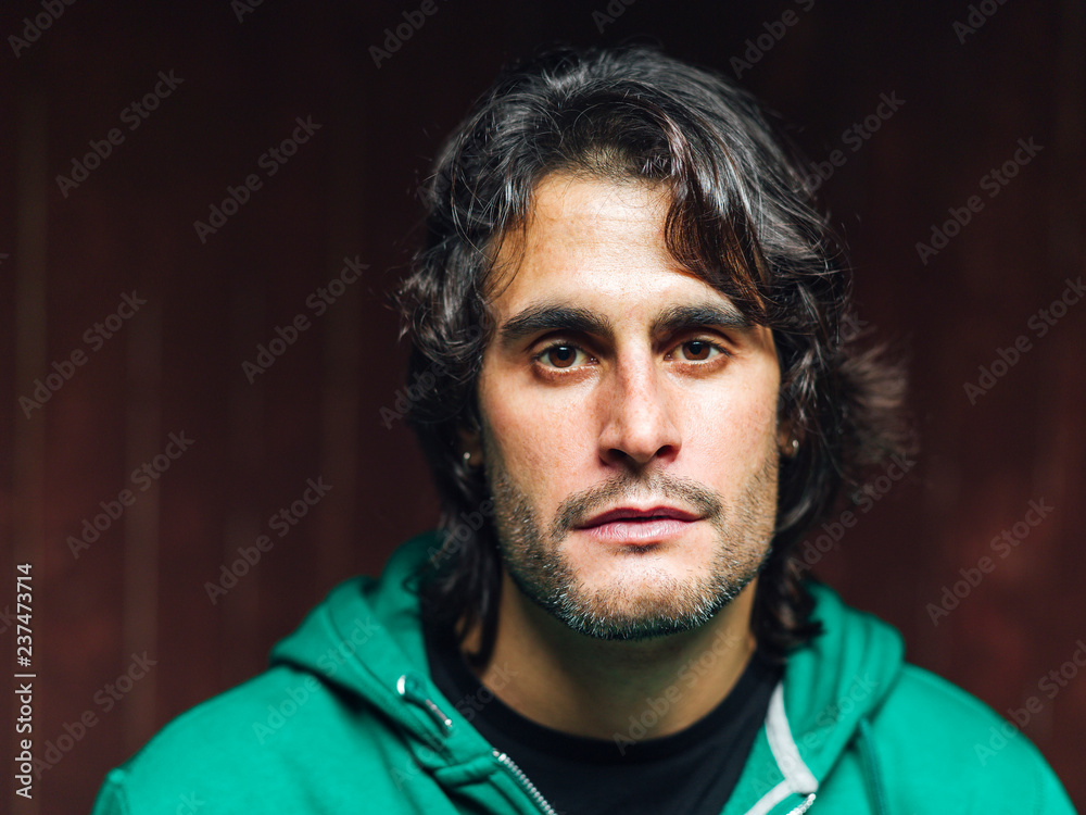 Portrait of confident man in studio in a serious pose Portrait of confident man in studio in a serious pose