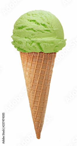 Pistachio, green tea, mint or kiwi fruit ice cream scoop isolated on white background with cone 