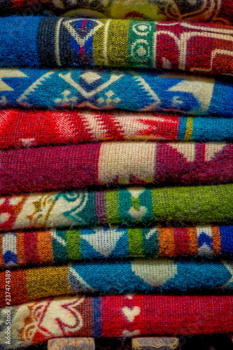 The typical andean fabrics sold on the handicrafts market of Otavalo, Ecuador