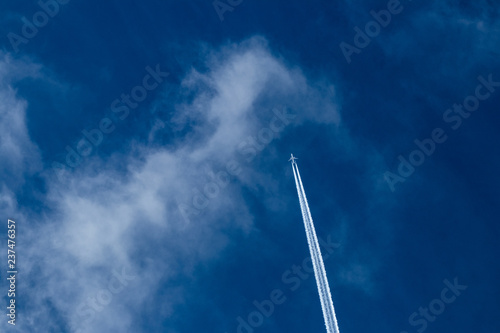 Blue sky with airplane