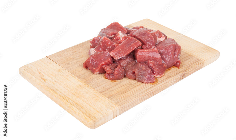 fresh meat on a wooden cutting board isolated on white background