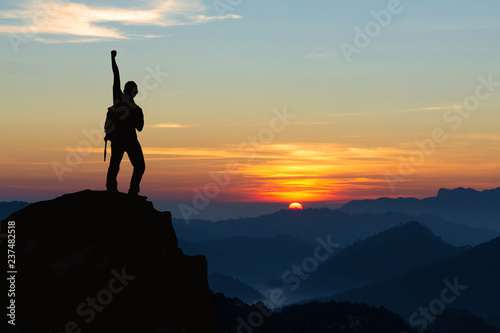 Silhouette of hiker man on top of mountain. successful people concept © AungMyo