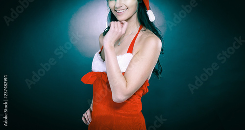 young surprised woman dressed as Santa Claus