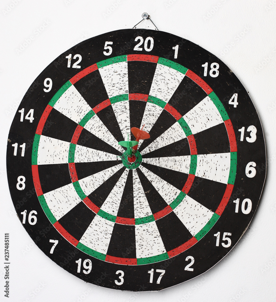 side view.Arrow dart hitting the center of the target dart Board side view.Arrow dart hitting the center of the target dart Board