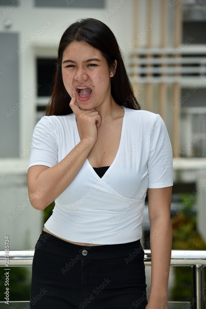 Fototapeta premium Young Asian Adult Female With Toothache