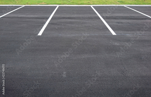 Empty parking with white marking line © Rawich Liwlucksaneey