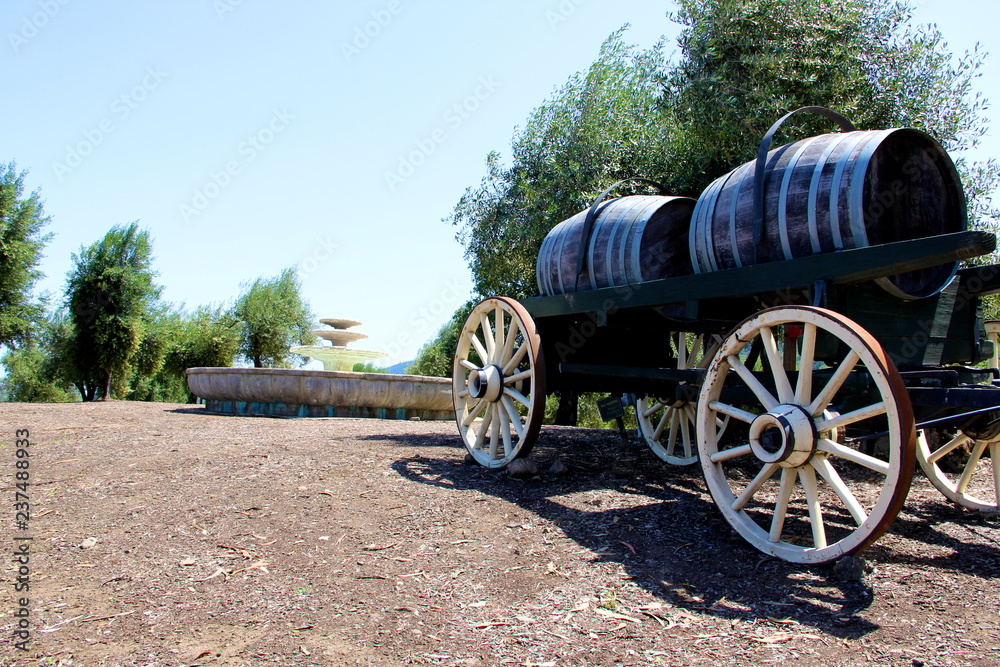 old wagon with barrels on it