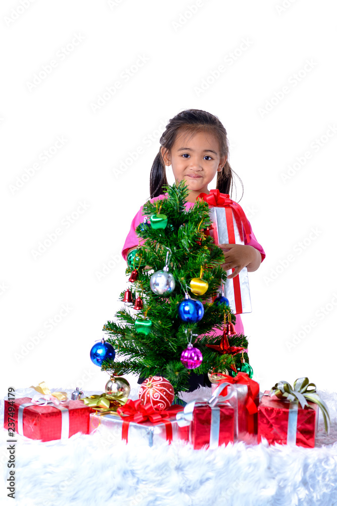 Happy asian child holding Christmas presents. Christmas or happy newyear time Happy asian child holding Christmas presents. Christmas or happy newyear time