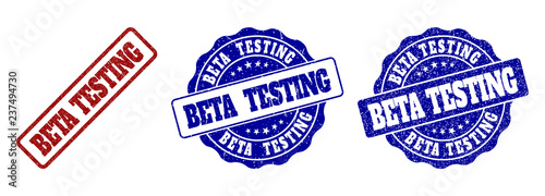 BETA TESTING grunge stamp seals in red and blue colors. Vector BETA TESTING labels with grunge texture. Graphic elements are rounded rectangles, rosettes, circles and text titles.