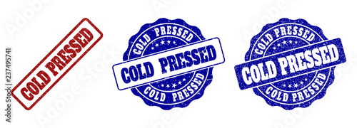 COLD PRESSED grunge stamp seals in red and blue colors. Vector COLD PRESSED watermarks with grunge effect. Graphic elements are rounded rectangles, rosettes, circles and text labels.