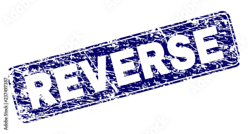 REVERSE stamp seal print with grunge style. Seal shape is a rounded rectangle with frame. Blue vector rubber print of REVERSE label with grunge texture.