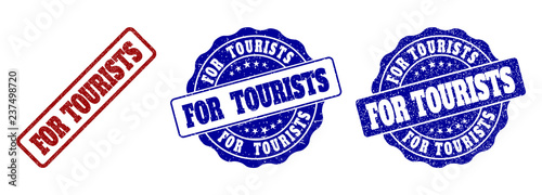 FOR TOURISTS grunge stamp seals in red and blue colors. Vector FOR TOURISTS watermarks with grunge texture. Graphic elements are rounded rectangles, rosettes, circles and text titles.