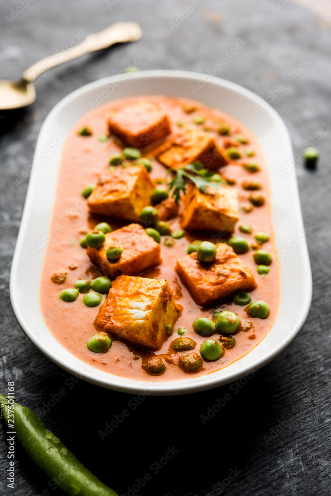 Green peas or matar paneer curry recipe, served in a bowl. selective focus