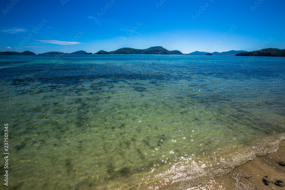 Background of the sea, blue sky wallpaper, the beauty of nature in bright weather, green water looks refreshing. Background of the sea, blue sky wallpaper, the beauty of nature in bright weather, green water looks refreshing.