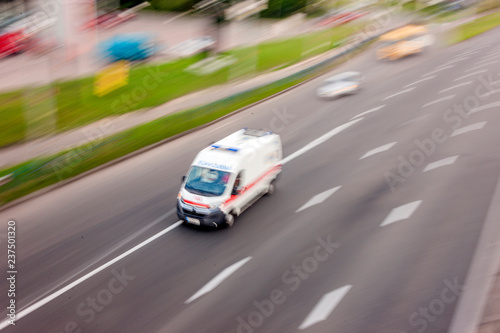 Ambulance in the city on a blurred background .