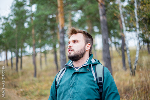 male hiker is looking at a distance