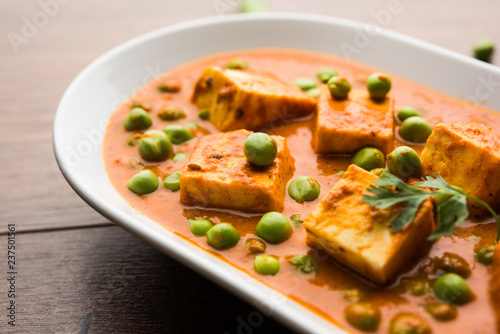 Green peas or matar paneer curry recipe, served in a bowl. selective focus